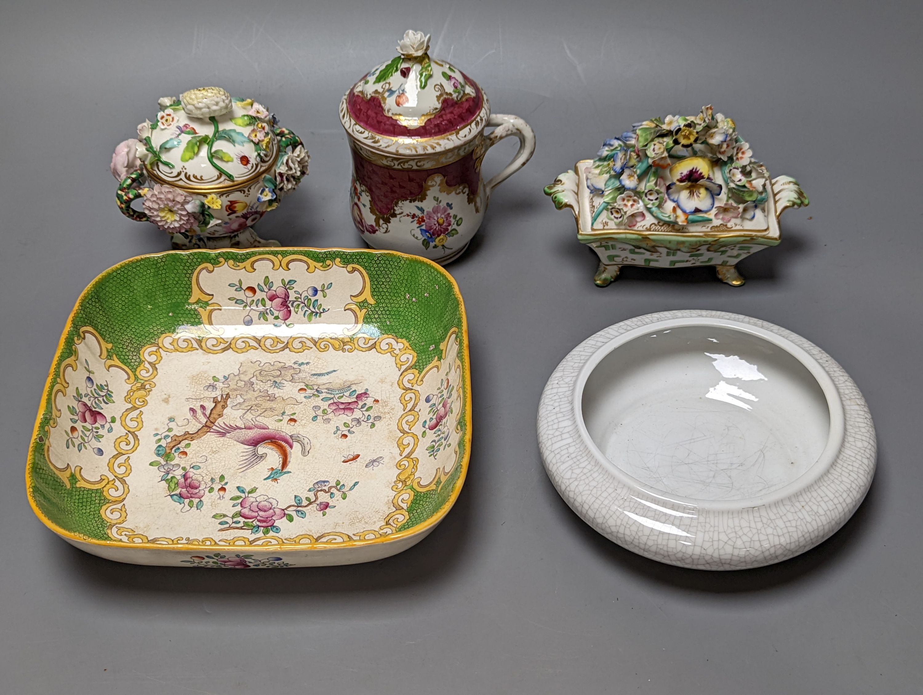 A Meissen style chocolate cup and cover, two mid 19th century English porcelain flower encrusted pots and covers and two dishes